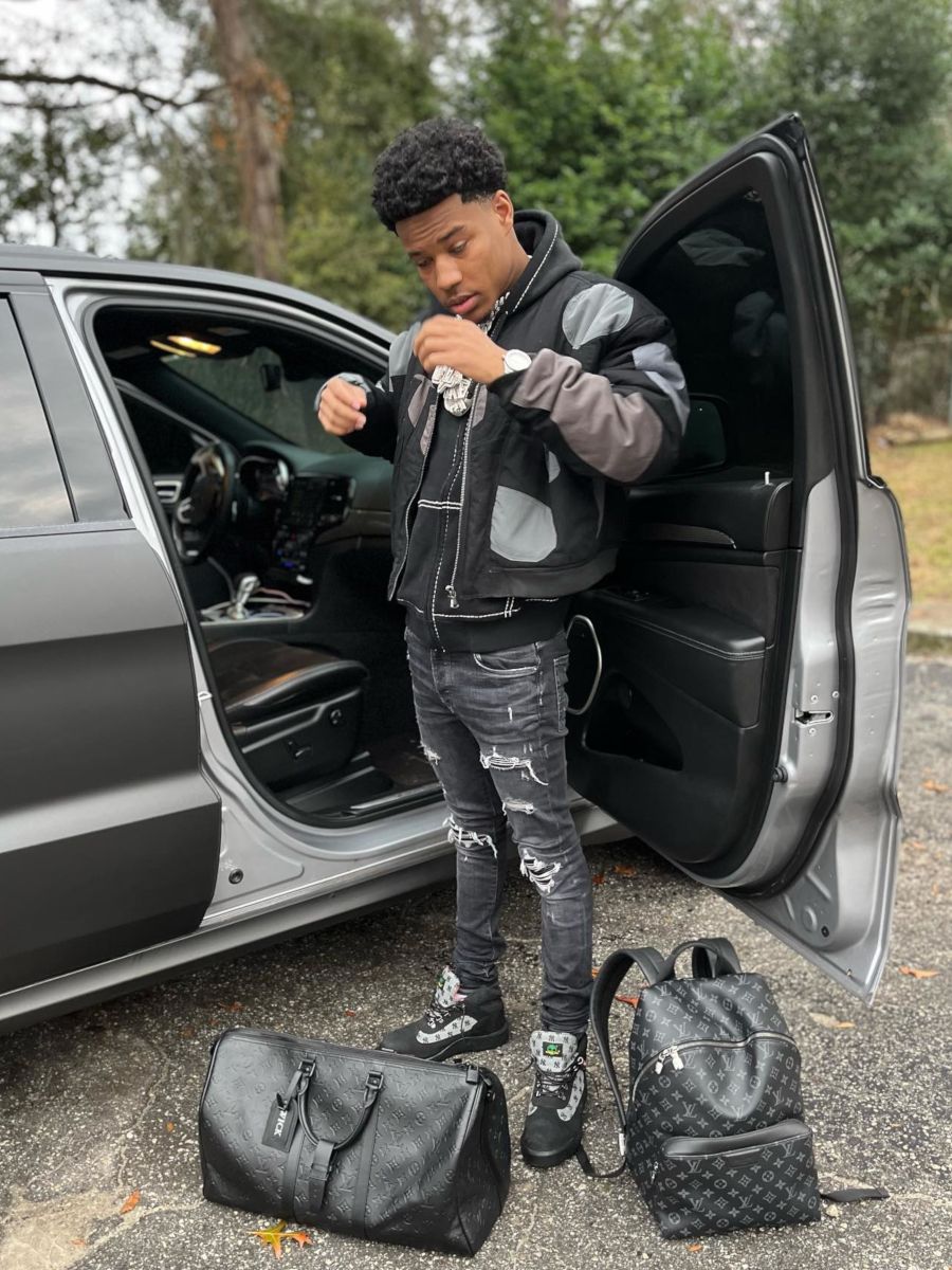 Nardo Wick Shows Off His Louis Vuitton Bags In a WDW & Timberland x Supreme Outfit