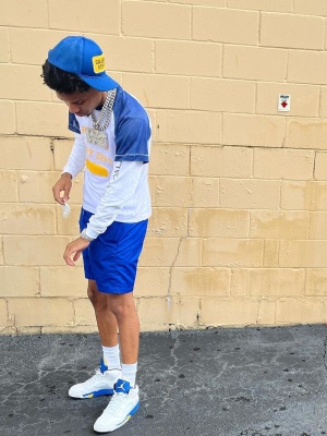 Nardo Wick Wearling A Gallery Dept White Mesh Tee With Blue Shorts And Jordan Sneakers