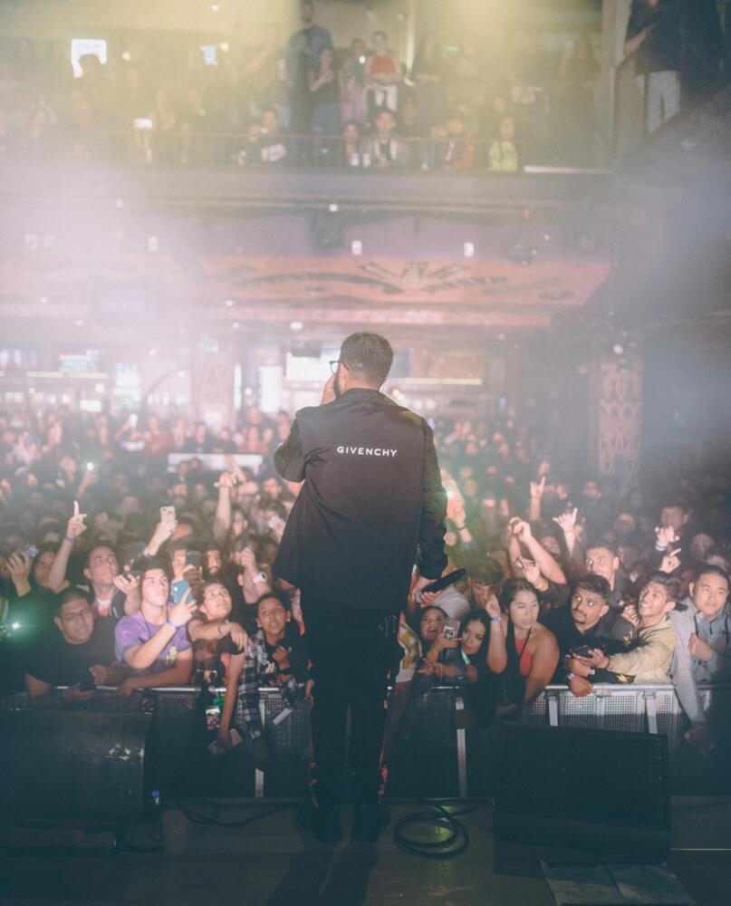 Nav Performs In San Diego Wearing a Givenchy Jacket, & Amiri Cargo Pants