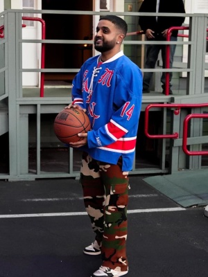Nav Wearing A Saint Mxxxxxx Hockety Jersey With Chrome Hearts Camo Sweatpants And Jordan 1s