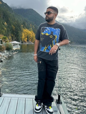 Nav Wearing A Vintage Batman Tee With Louis Vuitton Jeans And Lv Maxi Sneakers