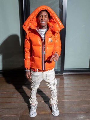 Nba Youngboy Wearing A Moncler Orange Puffer With A Louboutin Belt Guapi Jeans And Balenciaga Track Sneakers