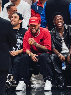 Neymar Wearing A Supreme Red Box Ologo Hat With A Balenciaga Taped Logo Tee And Louis Vuitton Sneakers
