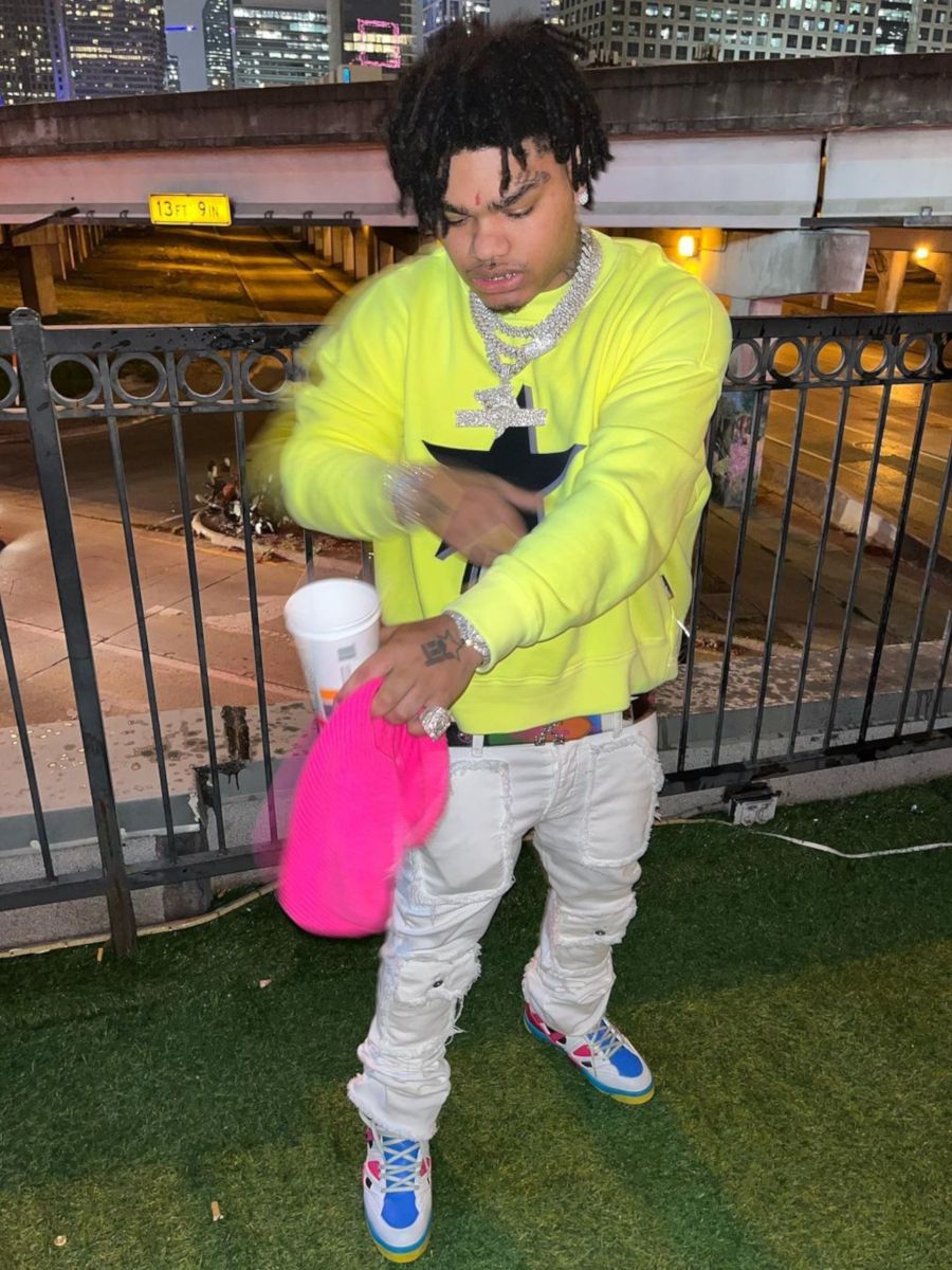 NoCap Wearing a Palm Angels Sweatshirt With Cargo Jeans & Gucci Sneakers