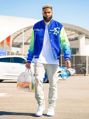 Odell Beckham Jr Wearing A Louis Vutton Jacket With Louis Vuitton Embellished Jeans A Iridescent Monogram Bag And Nike Air Force 1 Low Sneakers