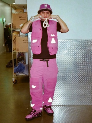 Ohgeesy Wearing A Palace Pink Vest And Cargo Pants With Pink Nike Sneakers