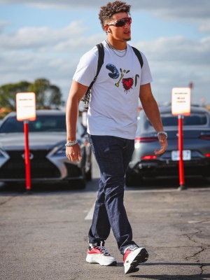 Patrick Mahomes Wearing Oakley Sunglasses With A Dior X Cactus Jacket Bugs Logo Tee Dior Jeans And Dior Sneakers