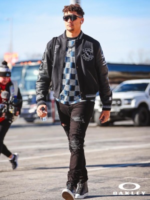 Patrick Mahomes Wearing Oakley Sunglasses With An Amiri Records Jacket Louis Vuitton Damier Tee Amiri Jeans And Louis Vuitton Sneakers