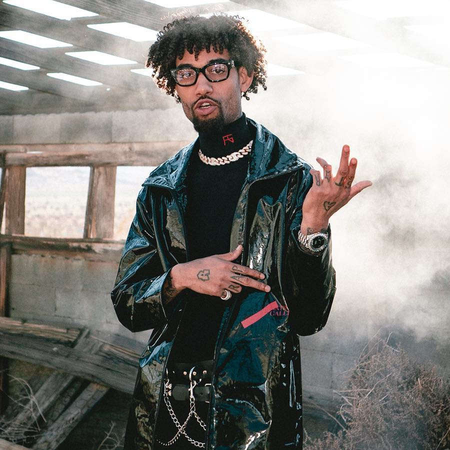 PnB Rock Rocks Out In a Raf Simons Sweater & A Cold Wall PVC Coat