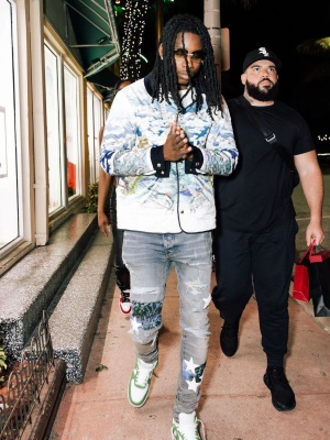 Polo G Wearing A Casablanca Quilted Jacke With Amiri Art Patch Jeans And Nike X Louis Vuitton Sneakers