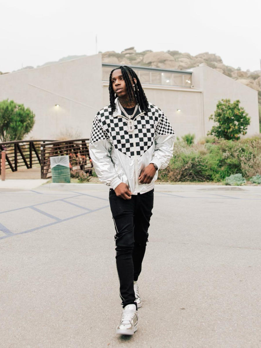 Polo G Wearing a Checkered Jacket With Crystal Jeans & Metallic Sneakers