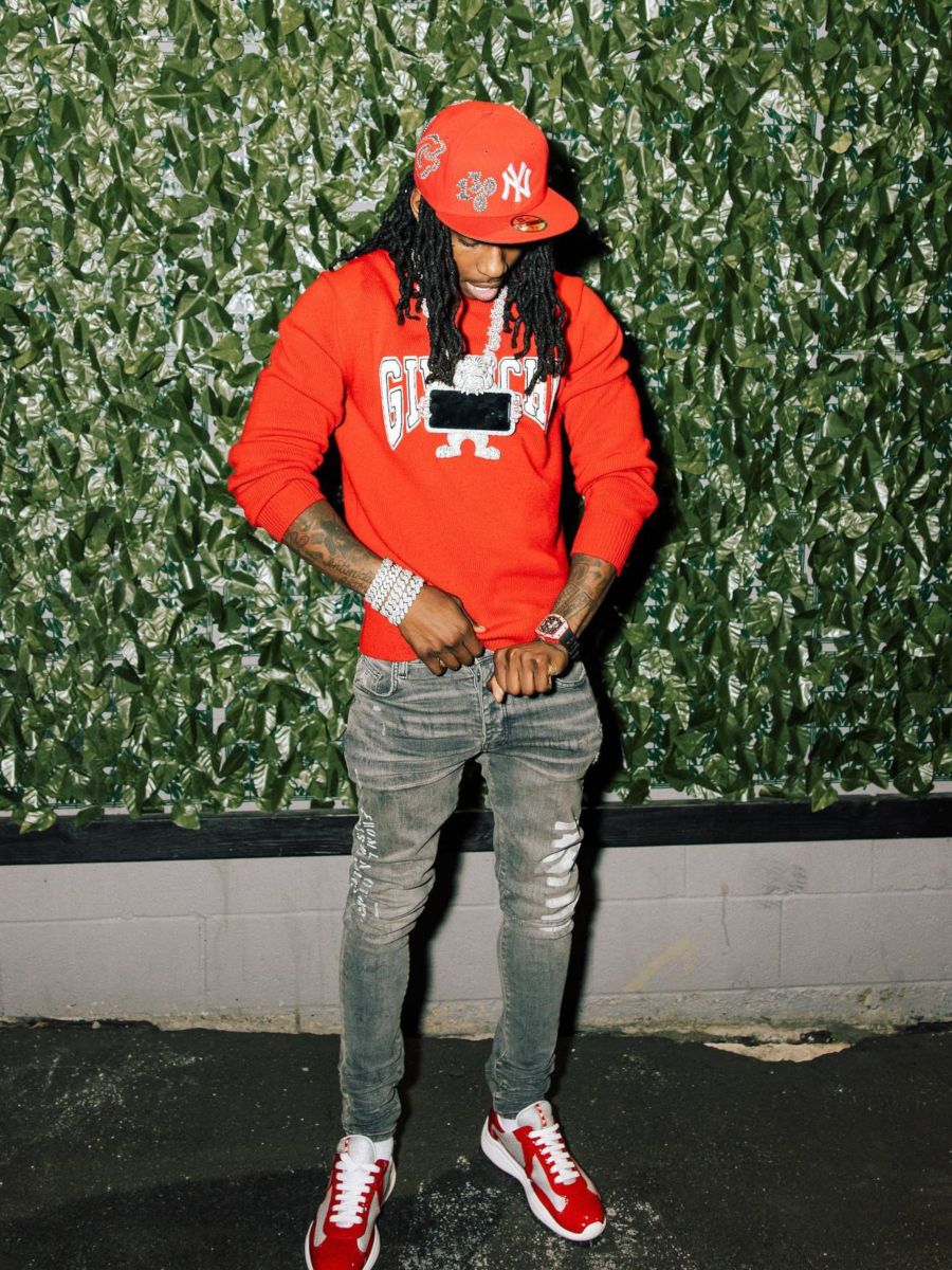 Polo G Poses On IG In a Givenchy Sweater & Amiri Logo Jeans Outfit