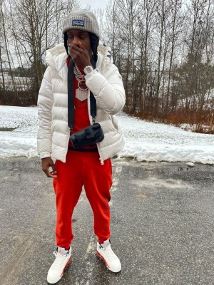 Polo G Wearing A Grey Patagonia Beanie With A Moncler Puffer Alexander Mcqueen Hoodie And Sweatpants And Jordan 5s
