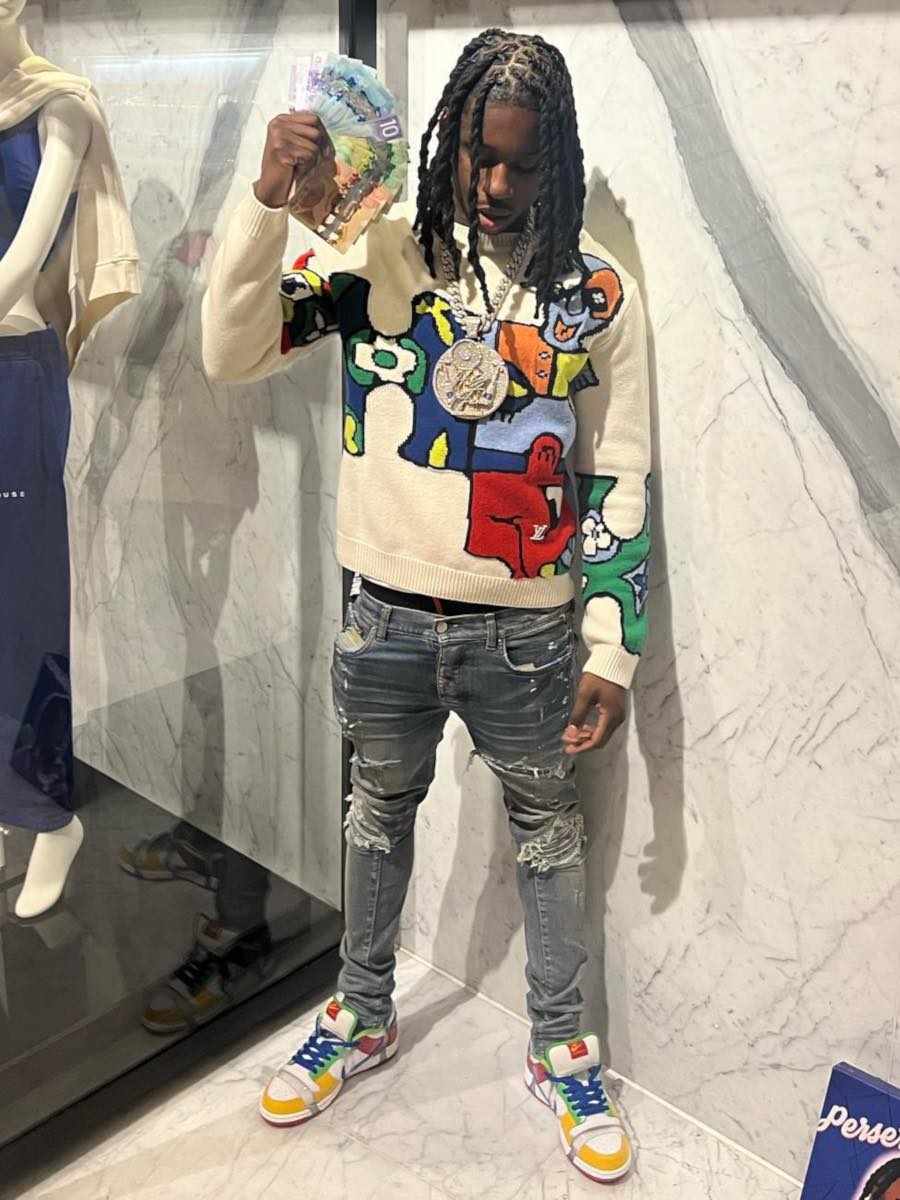 Polo G Wearing a Multicolor Louis Vuitton Sweater With Matching 'eBay' Nike Dunks