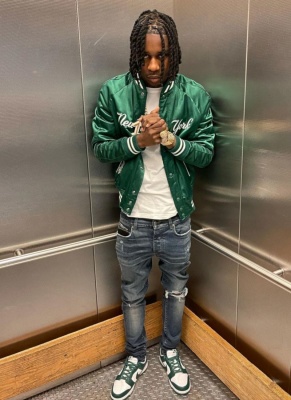 Polo G Wearing A Polo Ralph Lauren X New York Yankees Dark Green Satin Bomber Jacket And Nike Dunk Sneakers