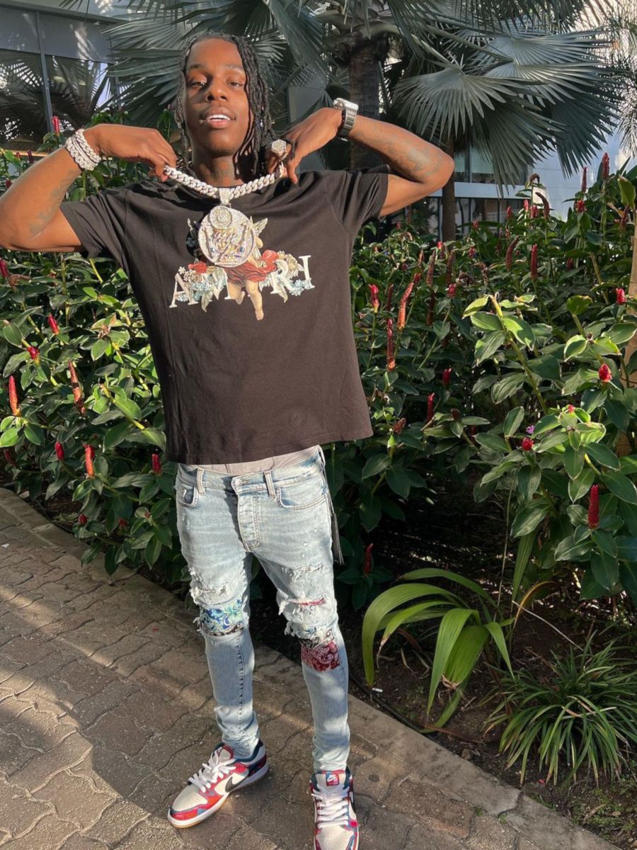Polo G Wearing an Amiri Tee & Jeans With Nike x Parra Dunks