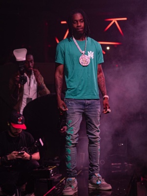 Polo G Wearing An Amiri Green Teal Blue Ma Logo T Shirt With Amiri Clay Indigo And Bones Jeans And Jordan X Union Sneakers