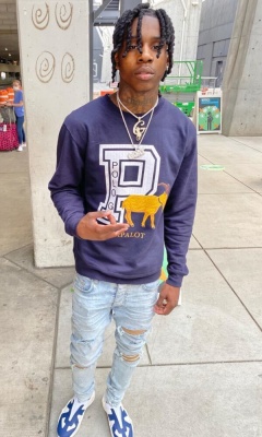 Polo G Wearing Capalot Merch Sweatshirt With Amiri Jeans And Margiela Sneakers