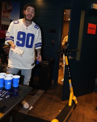 Post Malone Wearing A Dallas Cowboys Jersey And Vans With His Bird Scooter