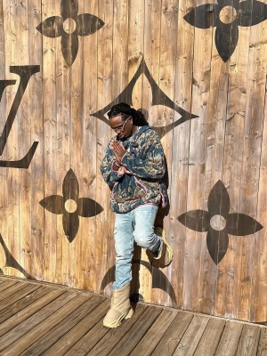 Quavo Wearing A Kapital Sherpa Fleece Hoodie With Distressed Jeans And Yeezy Boots