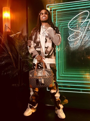 Quavo Wearing A Louis Vuitton Portrait Jacket And Pants With A Goyard Bag And Lv Trainer 2 Sneakers