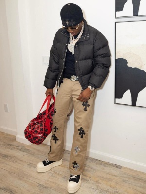 Real Boston Richey Wearing A Chrome Hearts Beanie Puffer Jacket Khaki Cross Pants And Red Cross Duffle Bag