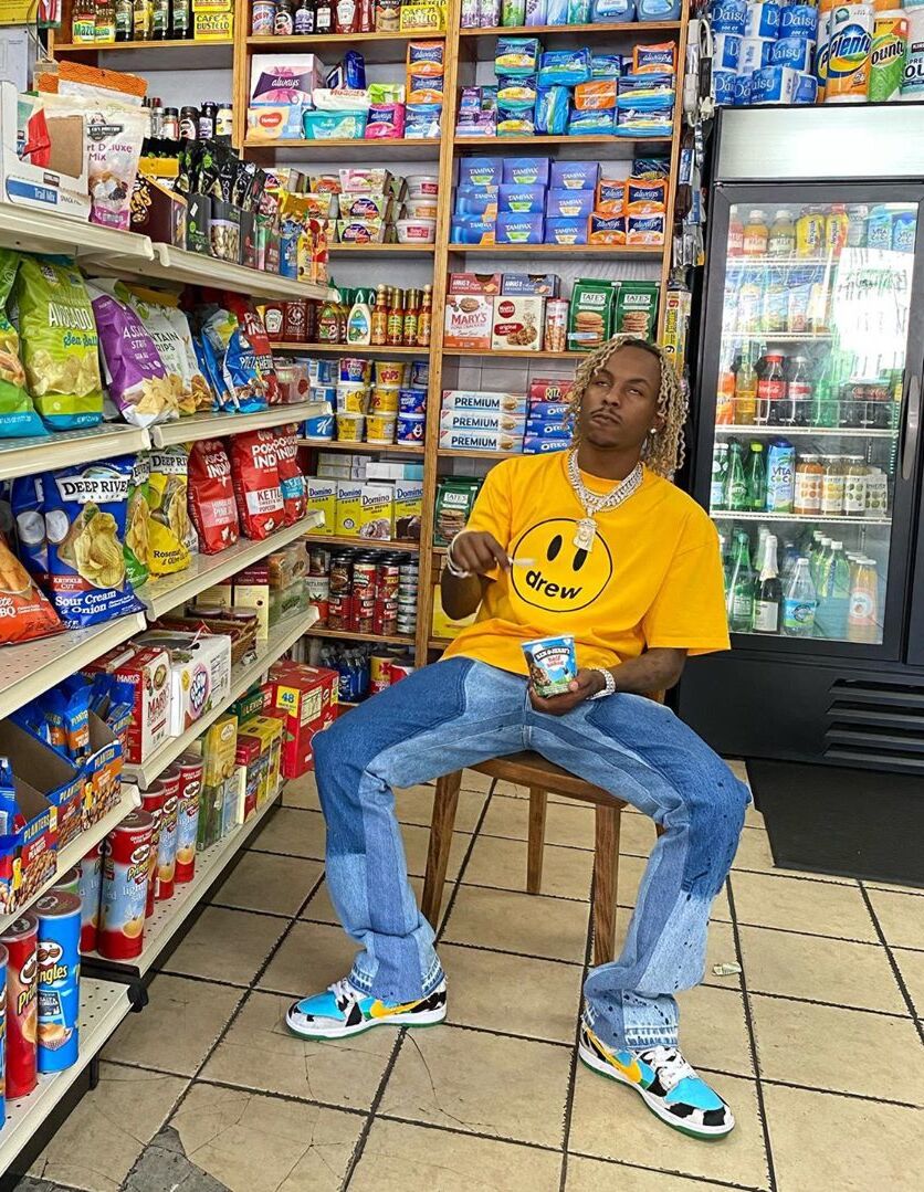 Rich The Kid Chills At The Cornerstore In a Drew Tee, Gallery Dept Denim, & Nike Dunks