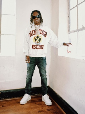 Rich The Kid Wearing A Balenciga Hoodie With Blue Jeans And Valentino Sneakers