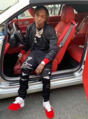 Rich The Kid Wearing A Black Bomber Jacket With Amiri Jeans And Alexander Mcqueen Sneakers
