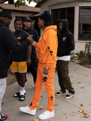 Rich The Kid Wearing An Off White X Chrome Hearts Hoodie And Jeans With Nike Af1s