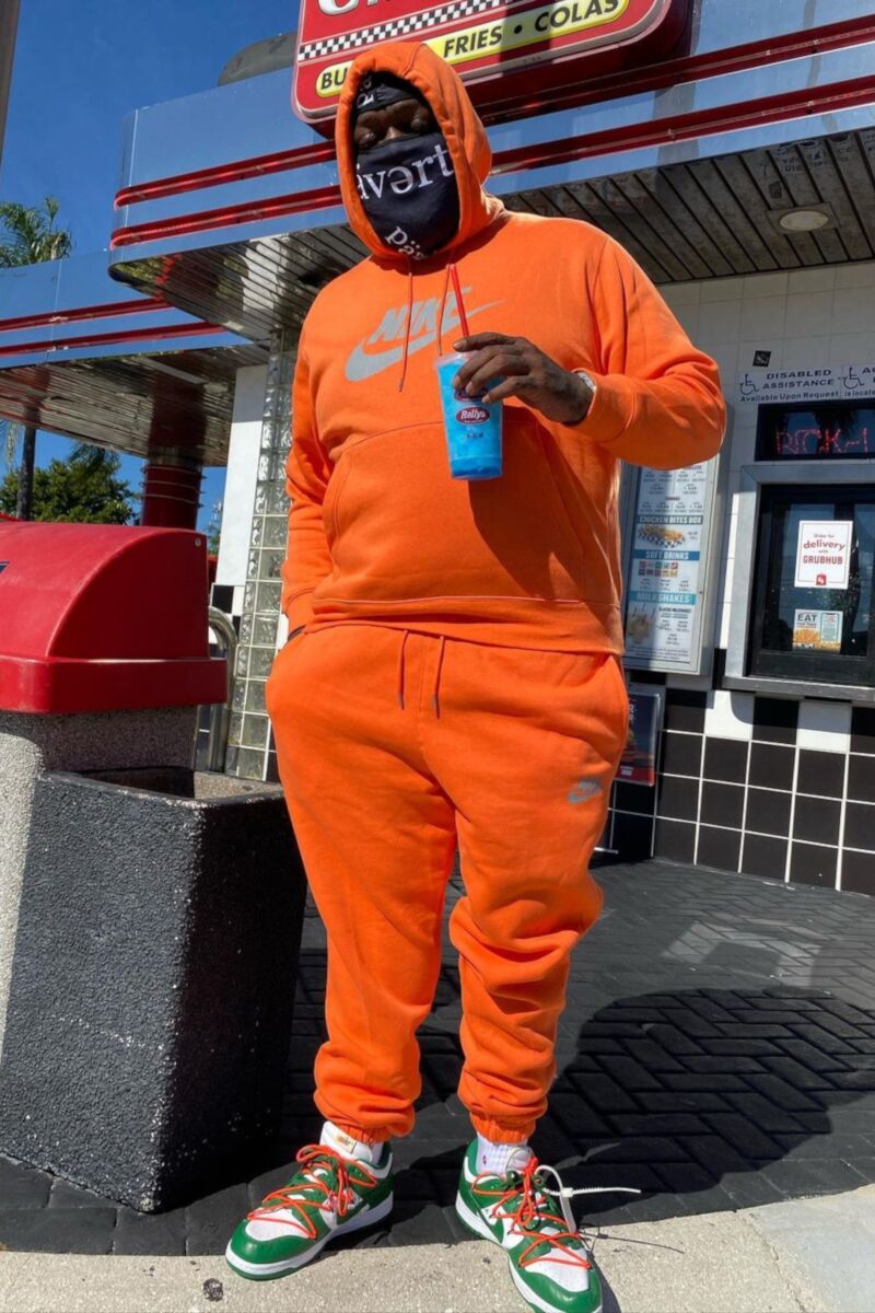 Rick Ross Wearing a Nike NSW Orange Hoodie & Joggers With Off-White Dunks |  Incorporated Style