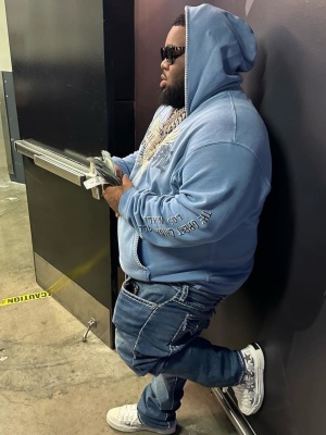 Rod Wave Wearing An Amiri X Tgcw Blue Hoodie And White Star Sneakers