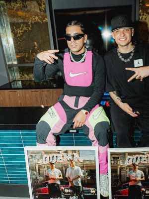 Ryan Castro Wearing A Nike X Ambush Hot Pink Vest And Pants With Givenchy Sunglasses And Nike Sneakers