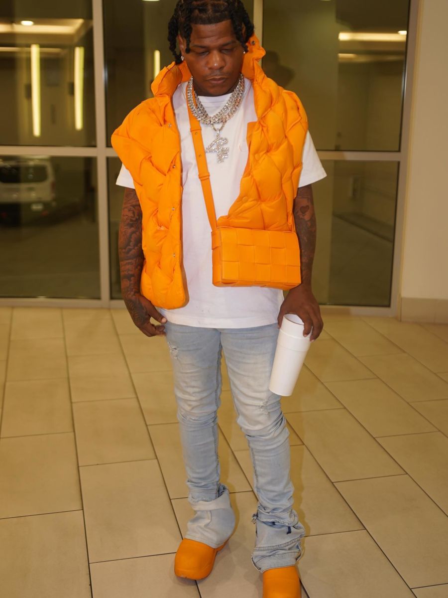 Rylo Rodriguez Wearing a Bottega Orange Puffer With a Matching Bag & Boots