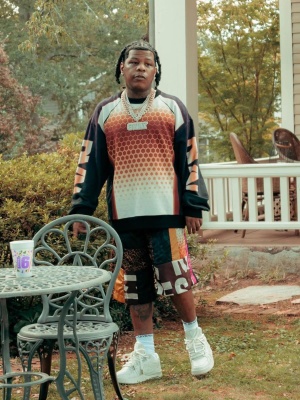 Rylo Rodriguez Wearing A Dries Van Noten Sweatshirt And Shorts With Readymade Socks