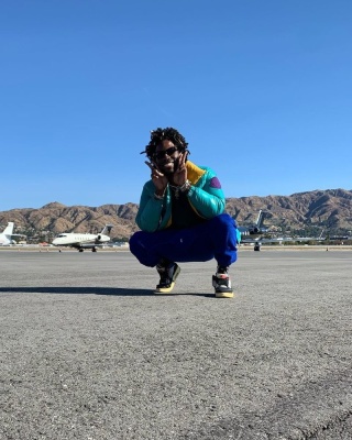 Saint Jhn Wearing A Moncler Puffer Jacket With Blue Sweatpants And Jordan X Union Sneakers