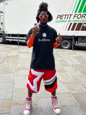 Saint Jhn Wearing Silver Sunglasses With A Balenciaga And Chrome Hearts Tee And Rick Owens Sneakers