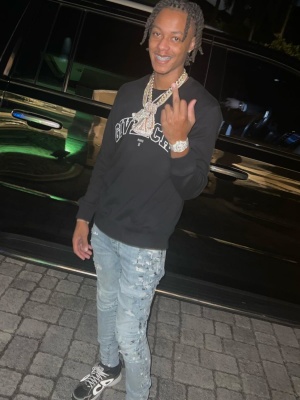 Skilla Baby Wearing A Givency Black Sweatshirt With Amiri Paint Mx1 Jeans And Dior Sneakers