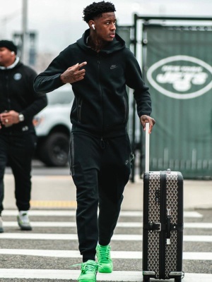 Suace Gardner Wearing A Nike Sportswear Tech Zip Hoodie And Joggers With A Goyard Suitcase And Nike X Off White Sneakers
