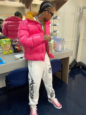 Swae Lee Wearing A Pink Moncler Puffer Jacket And White Sweatpants With Alexander Mcqueen Sneakers