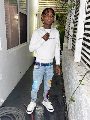 Swae Lee Wearing An Off White Sweatshirt Louis Vuitton Belt Amiri X Playboy Jeans And Off White Sneakers