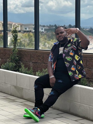 Tee Grizzley Wearing A Prada Double Match Shirt With Amiri Mx1 Jeans And Nike Af1 Sneakers
