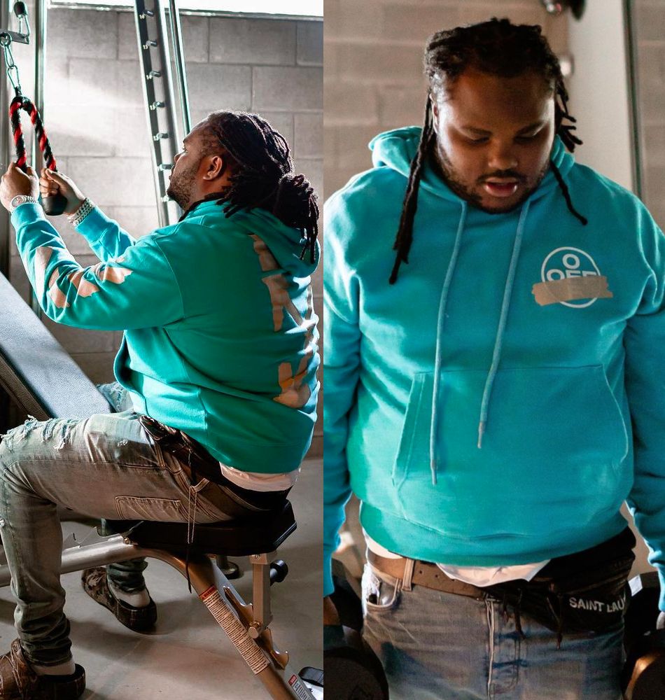 Tee Grizzley Wearing an Off-White Hoodie With Amiri PJ Jeans & Camo Crocs