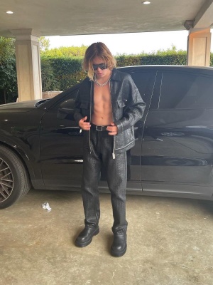 The Kid Laroi Wearing A Givenchy Black Leather Jacket And Pants With Bottega Veneta Boots