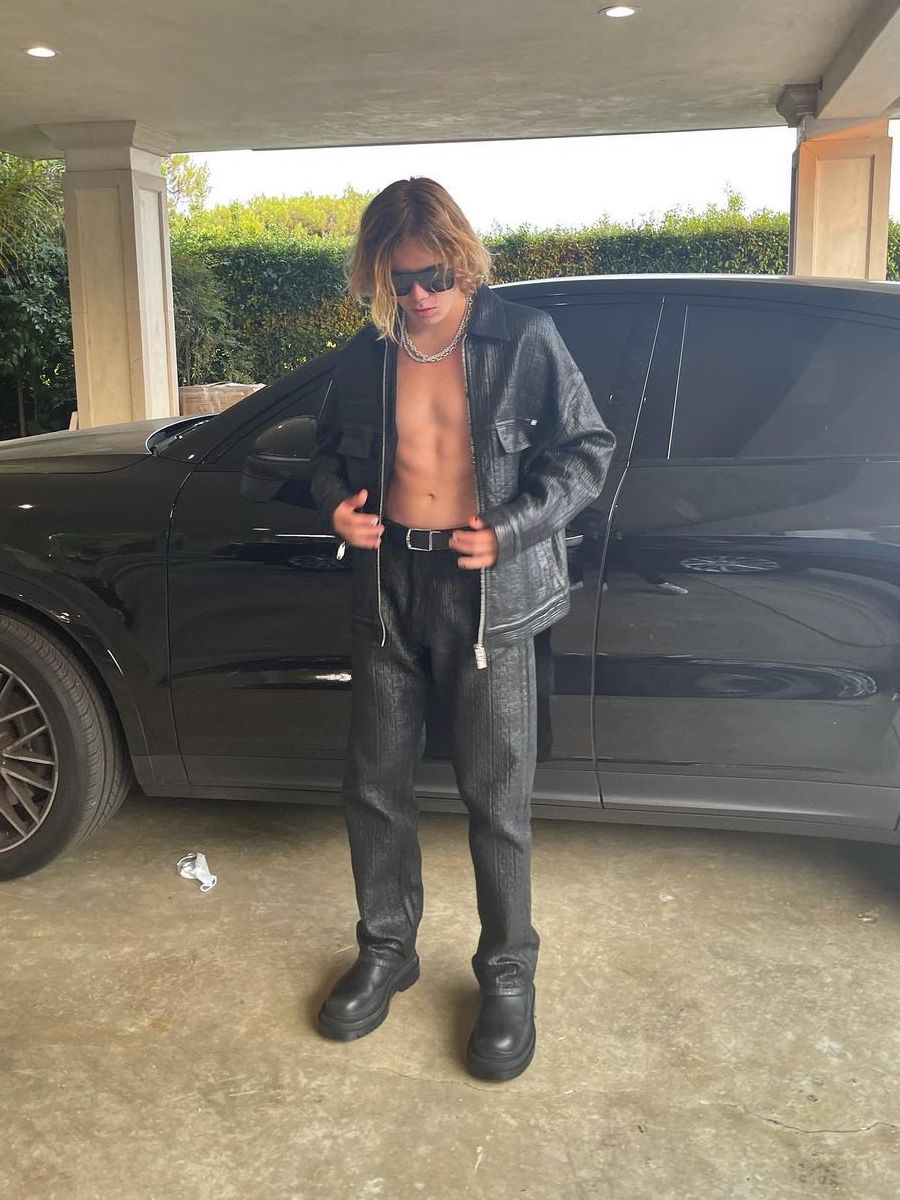 The Kid LAROI Wearing a Givenchy Jacket & Jeans With Bottega Veneta Boots