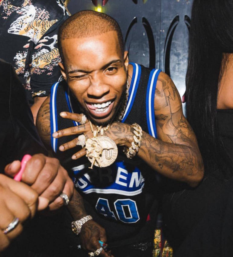 Tory Lanez Shows Off His Chain In a Supreme Jersey & Amiri Jeans