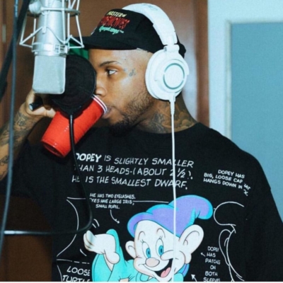Tory Lanez Wearing A Vintage Dopey Shirt And A Black Hat