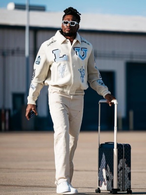 Travis Henry Wearing Lv Sunglasses With A Lv Varsity Jacket Lv Carpenter Pants And Wheeled Suitcase