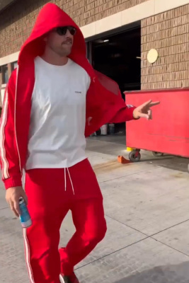 Travis Kelce Wearing A Celine Red Side Stripe Hoodie And Trackpants With White Small Logo Tee