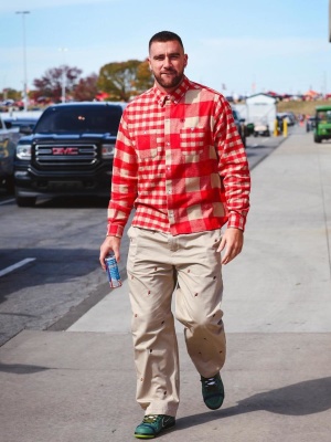 Travis Kelce Wearing A Red Flannel Shirt With Icecream Khaki Pants And Nike Dunks